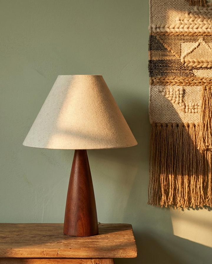 Linen Shade Accent Lamp against a sage green wall